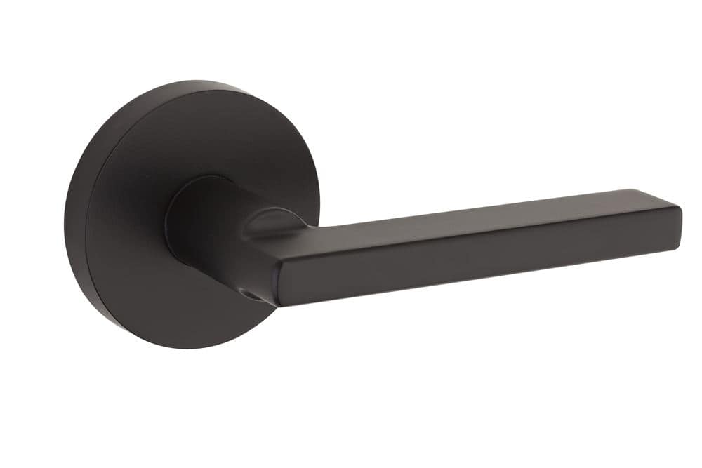 Black modern door handle with a rectangular lever on a circular base.